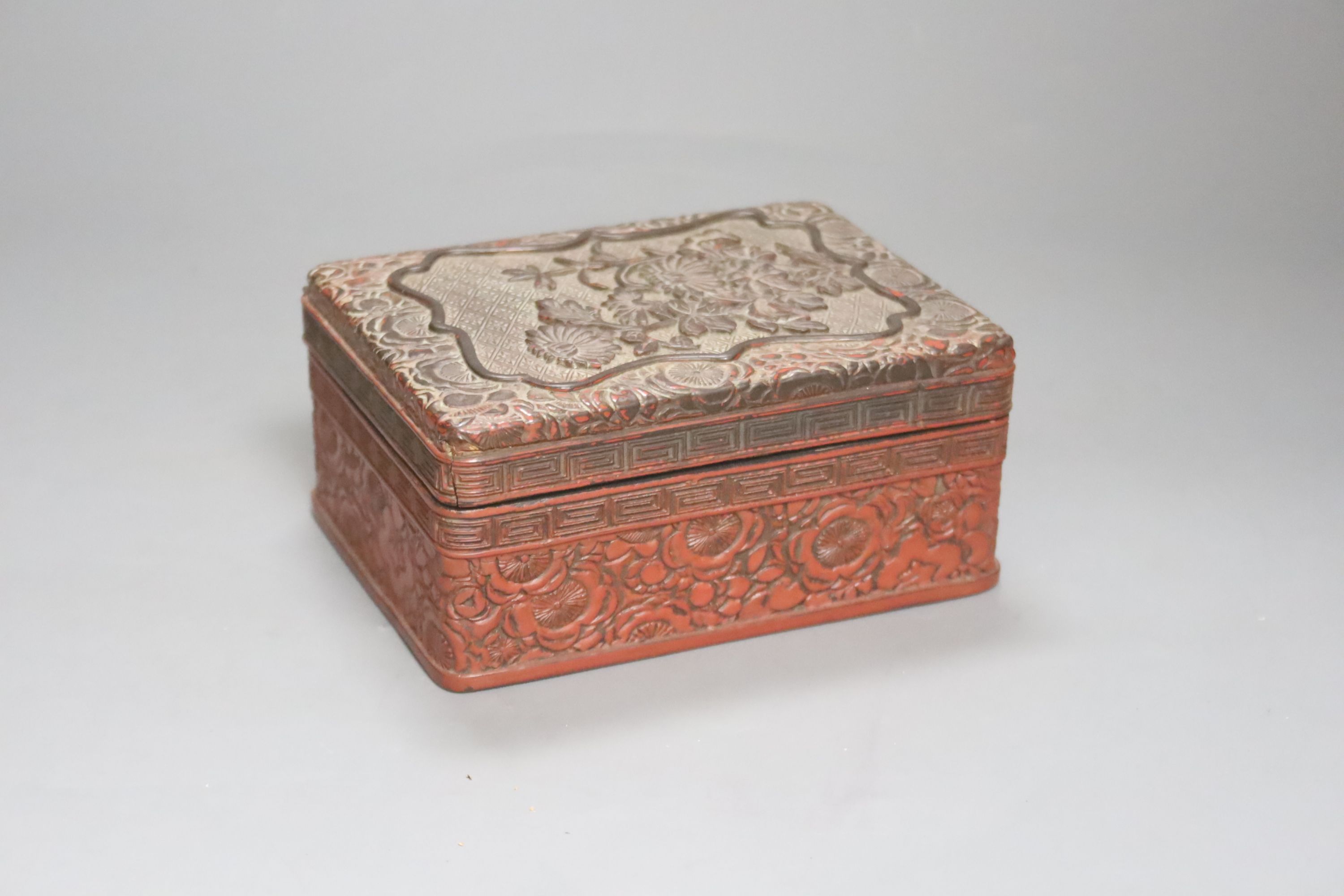 A Chinese cinnabar lacquer box and cover, length 14cm